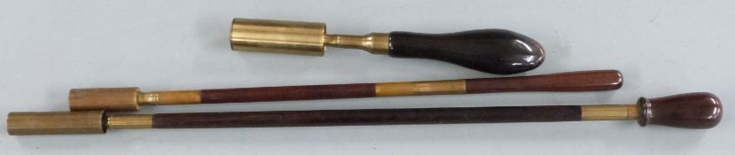 Three wooden and brass shotgun barrel and chamber cleaning rods/ brushes with covers, largest 44cm