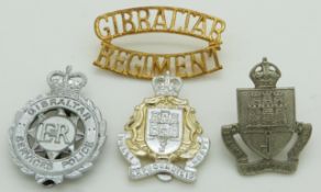 Four Gibraltar Defence Force / Regiment / Police badges, one by Fimin, another by Dowler