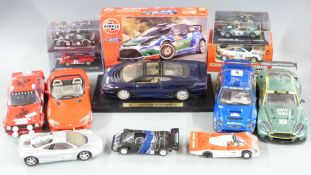 Nine diecast model vehicles including Le Mans racing cars, Dodge Viper, Aston Martin etc, some in