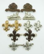 Twelve British Army Manchester Regiment metal collar badges in six pairs, including a pre 1923