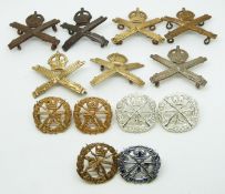 Thirteen British Army Machine Gun Corps, one silver by J.R.Gaunt, and Small Arms Corps metal