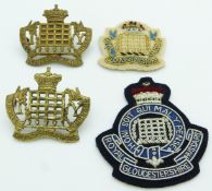 Four British Army Royal Gloucestershire Hussars badges
