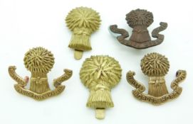 Five British Army Lothian and Berwickshire Imperial Yeomanry metal cap badge together with Lothian