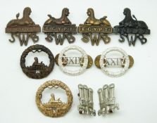 Eight British Army South Wales Borderers metal collar badges together with a pair for the Welsh