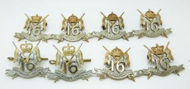 Eight British Army 16th Lancers metal badges with King's and Queen's crowns