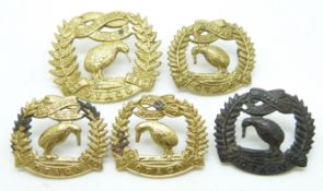 Five New Zealand Army 4th Otago Regiment metal cap and collar badges, three with Gaunt makers to
