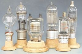 Six large electronic valves to include Toshiba P220, Brown Boveri, GEC etc, all on turned wooden