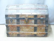 Ash and metal bound dome topped travelling trunk together, width 82cm with an animal skin rug