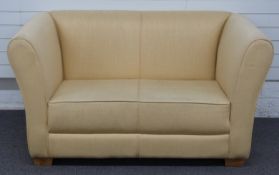 Cream upholstered sofa