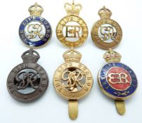 Six British Army Life Guards metal cap badges including two enamelled examples