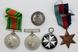 WWII medals comprising 1939-45 Stars, War Medal and Defence Medal, together with a WWI silver war