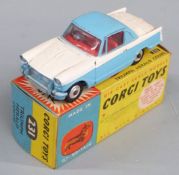 Corgi Toys diecast model Triumph Herald Coupe with two-tone blue and white body and red interior,