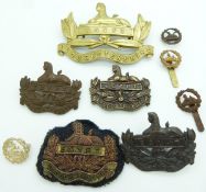 Nine British Army Gloucestershire Regiment badges including bronze, brass and cloth / bullion