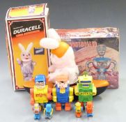A collection of vintage robots including a Duracell Bunny and a Radio Shack Radio Controlled