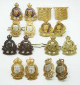 Sixteen British Army Royal Ordnance Corps metal collar badges in five pairs plus six, two by J R