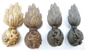 Four British Army Royal Welsh Fusiliers collar badges including a pair of officer's service dress