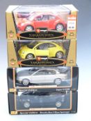 Four Burago and Maisto 1:18 scale diecast model cars Gold Collection Volkswagen New Beetle 1998 3342