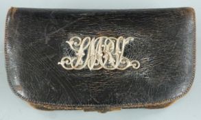 Antique .577 leather bound metal ammunition pouch with silver Middlesex Regiment badge, 18.5x10.5cm.