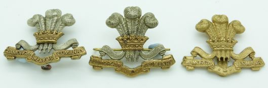 Three British Army Glamorgan Yeomanry metal cap badges including an Imperial Yeomanry example