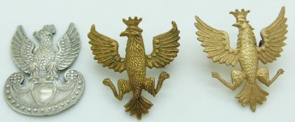 Polish Army metal cap badge together with two other similar examples