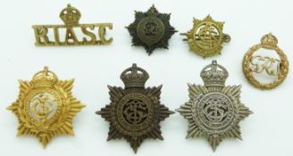 Seven Army Service Corps metal badges including East Africa, Royal Indian etc, one by Gaunt