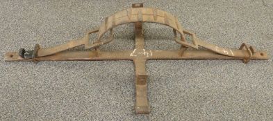 A late 18th/19thC iron man trap with double sprung mechanism and semi circular trap with