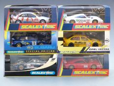 Six Hornby Scalextric model motor racing cars comprising two special edition Opel Vectra Promarket