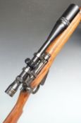 Short Magazine Lee Enfield SMLE No.4 Mk I .303 bolt-action rifle stamped at the wrist M47 1943' with