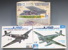 Four Italaerei 1:35 scale plastic model kits comprising Junkers JU52/3m, Armoured Car, BM-13