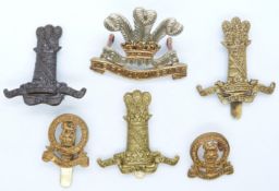 Six British Army Cavalry Regiments metal cap badges for the 11th Hussars, Royal Hussars and 14th/