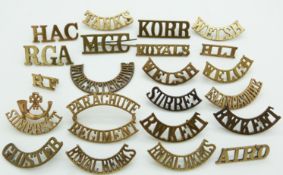 Small collection of British Army metal shoulder titles including Norfolk Yeomanry, Welsh Regiment,