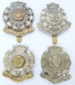 Four British Army Hampshire Regiment metal cap badges including a 3rd Volunteer Battalion example