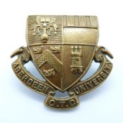 Aberdeen University Officer Training Corps white metal cap badge