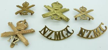 Six New Zealand Army metal badges including a shoulder title stamped Gaunt to reverse