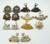 Fourteen British Army Bedfordshire Regiment, Hertfordshire Regiment etc. metal collar badges in