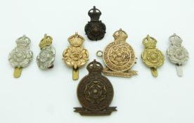 Eight British Army Queen's Own Yorkshire Dragoons metal badges including an officer's example