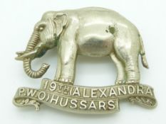 British Army 19th Hussars (Alexandra PWO) double scroll metal cap badge