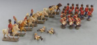 Twenty-five Elastolin soldiers including cavalry and bandsmen.