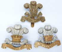 Three British Army 3rd Dragoon Guards metal badges including an all brass example