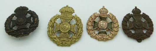 Four British Army Rifle Brigade metal hat badges including an enamelled pin back example