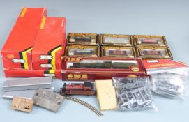 A collection of Hornby, Mainline and Airfix 00 gauge model railway locomotives, wagons and