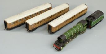 Hornby 00 gauge LNER 4-6-2 locomotive 'Flying Scotsman' 4472 and three matching coaches.