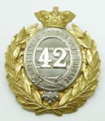 Cheltenham Gordon Boy's Brigade metal cap badge, voided numeral 42 within garter surrounded by