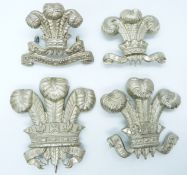 Four British Army 10th Royal Hussars 3rd Dragoon Guards metal badges including NCO's arm badge