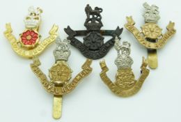 Five British Army The Loyal Regiment metal cap badges including an officer's example