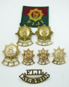 Nine Commonwealth Forces Fiji cap and collar badges in two pairs plus two, one shoulder title and