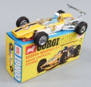 Corgi Toys diecast model Cooper-Maserati F/1 with driver controlled steering, yellow and white body,
