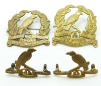 Two New Zealand Army 4th Waikato Mounted Rifles other ranks metal cap badges together with two metal