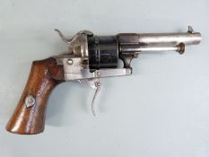Belgian 7mm pinfire six-shot double action revolver with shaped wooden grips, folding trigger and
