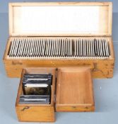 Two boxes of educational glass slides of scientific/biological interest, each approximately 8cm